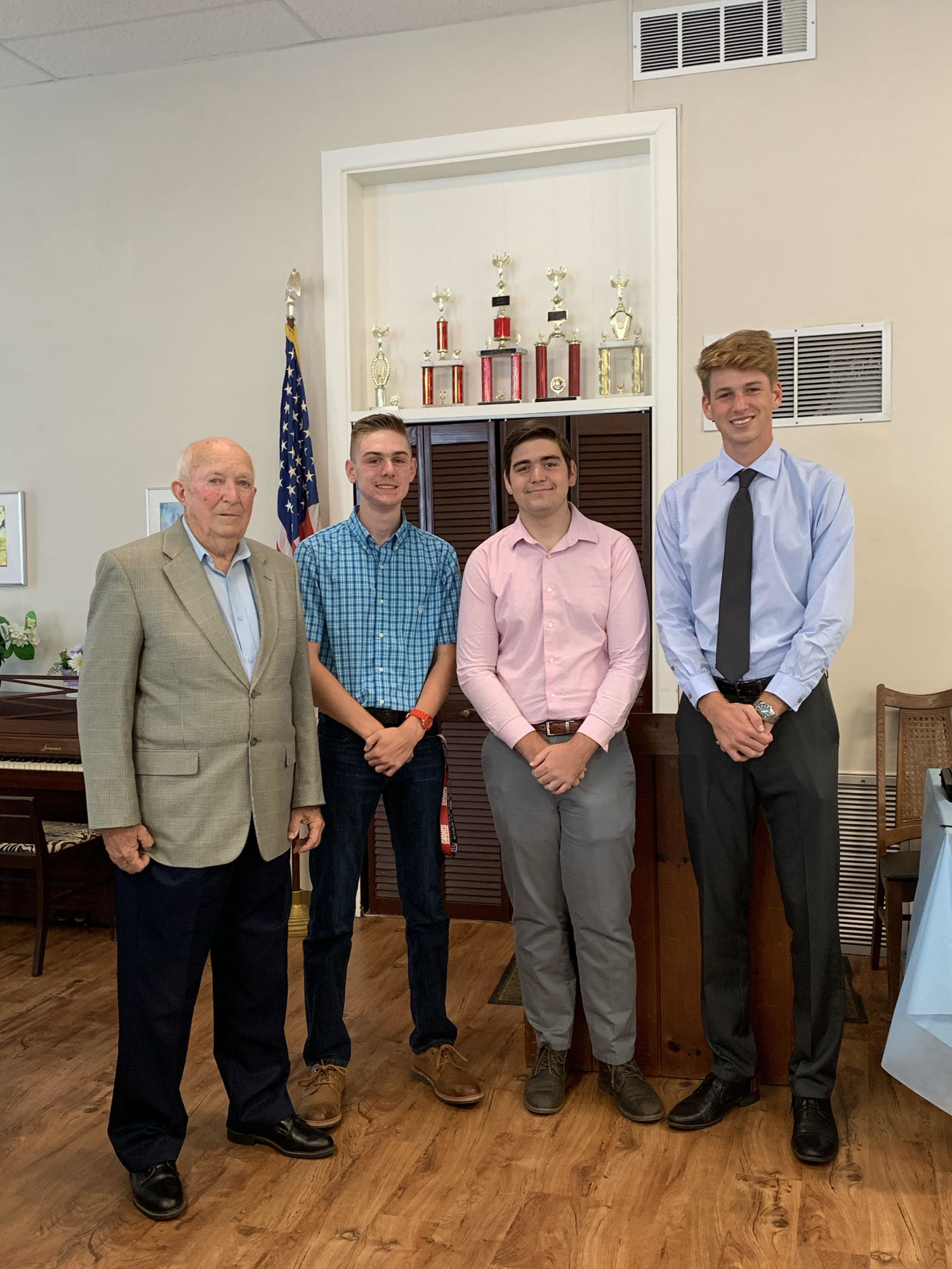 Gerard Slovak with Flagler Woman’s Club scholarship recipients Derek Hart, Tyler Perry, and Brock Underberg. Not pictured: Megan Brink and Daniella Shordone. Photo courtesy of Flagler Woman's Club