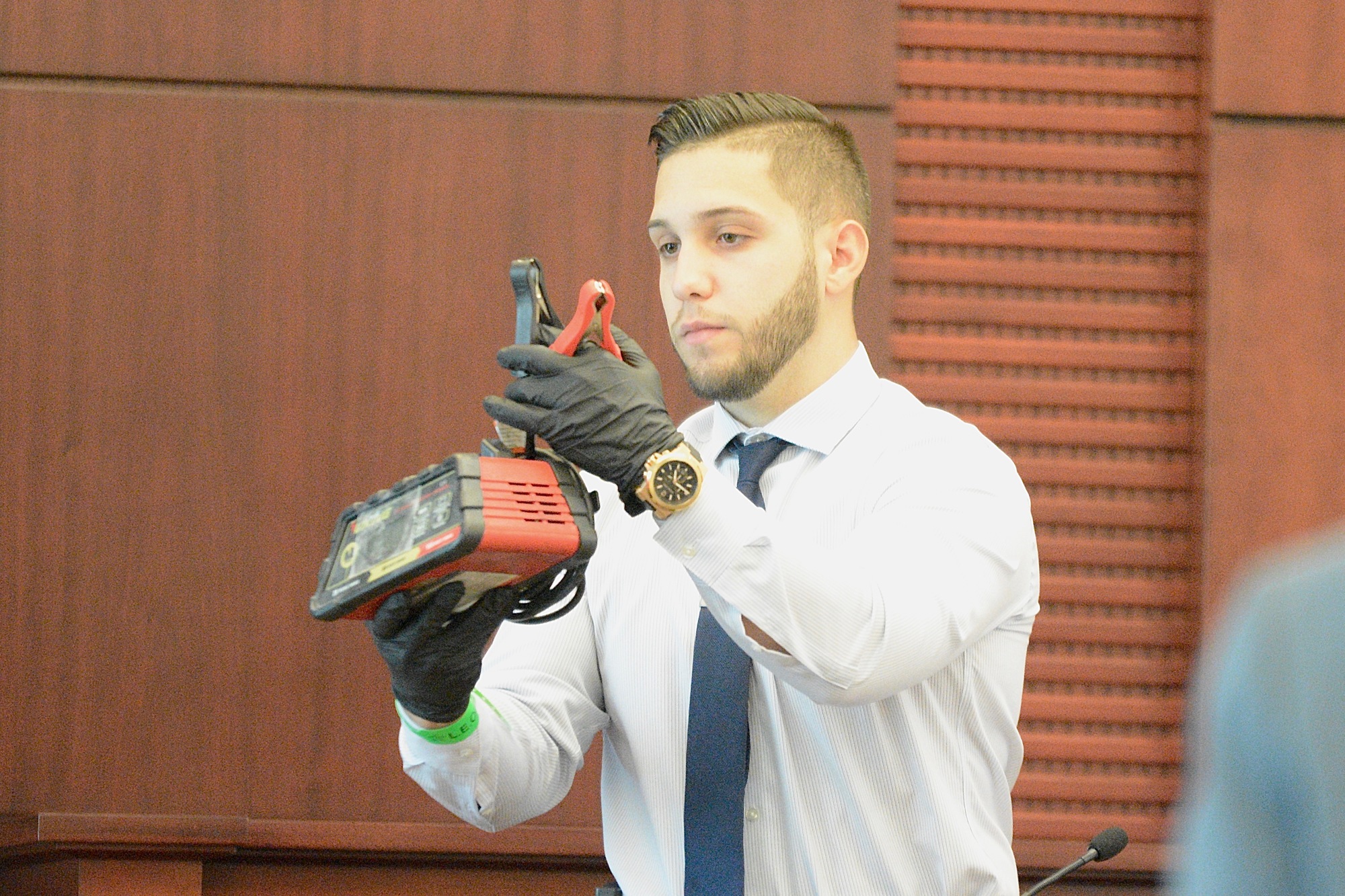 Deputy Omar Ocampo holds up part of the device found inside the home. (Photo by Jonathan Simmons)