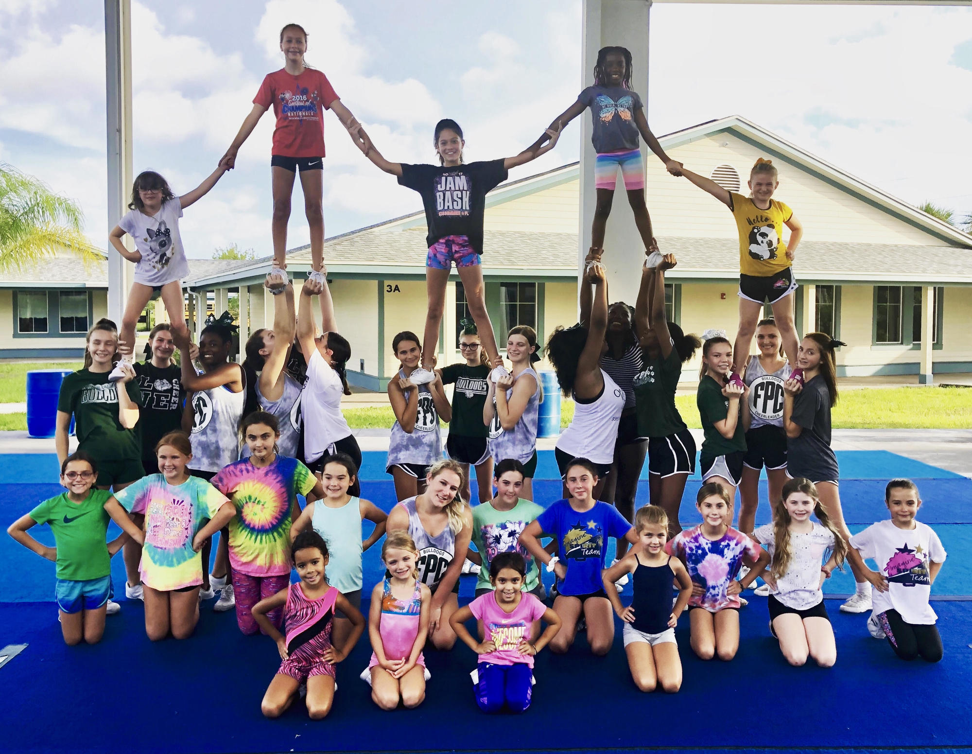 Flagler Palm Coast Cheerleaders helped the recreational youth cheerleaders who attended the Lions Tumbling & Stunts Cheer Camps.