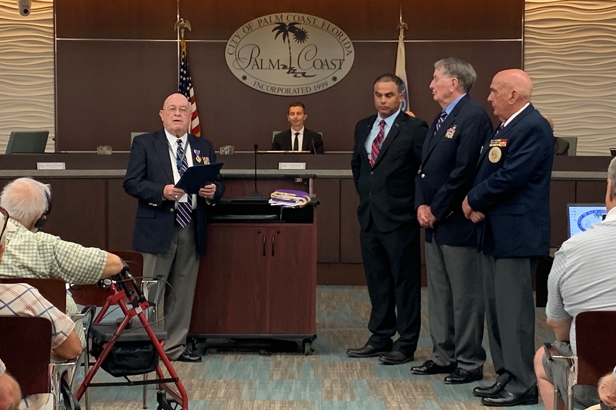 City Councilman Jack Howell, commandant of the Palm Coast chapter of the Military Order of the Purple Heart, reads the proclamation Aug. 6 (Photo by Jonathan Simmons)