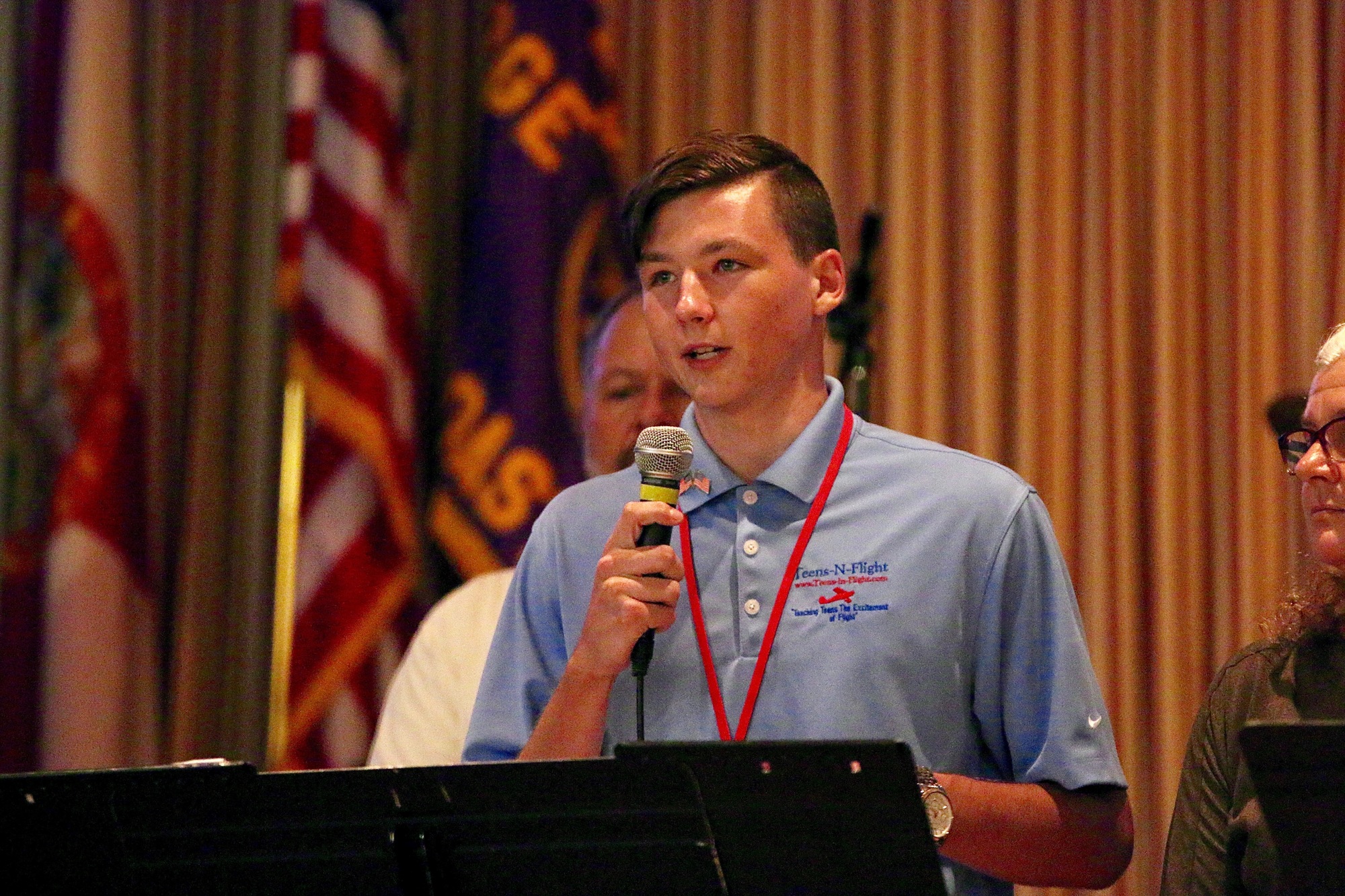 Colton Kent, 18 and Flagler Palm Coast High School student dual-enrolled at Daytona State College, addresses attendees at Teens-in-Flight's Hangar Party Aug. 10. (Photo by Jonathan Simmons)