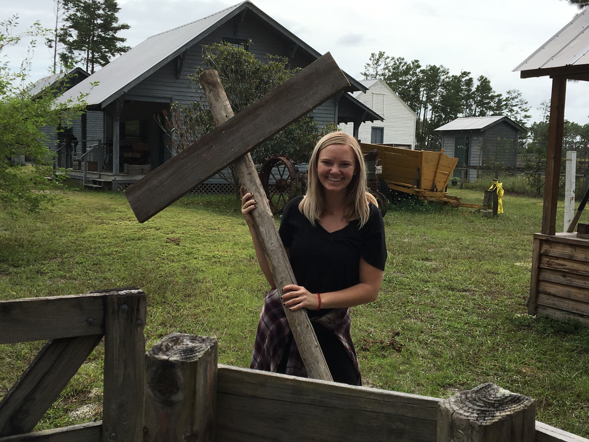Lauren Umpenhour carries a faux grave marker to be planted. Photo by Joey Pellegrino