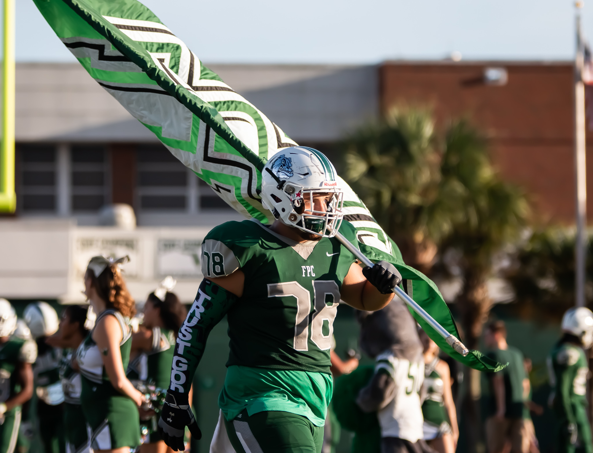 Bulldogs offensive lineman Devon Conkrite waves the FPC flag during the season opener against Matanzas. Photo by Ray Boone