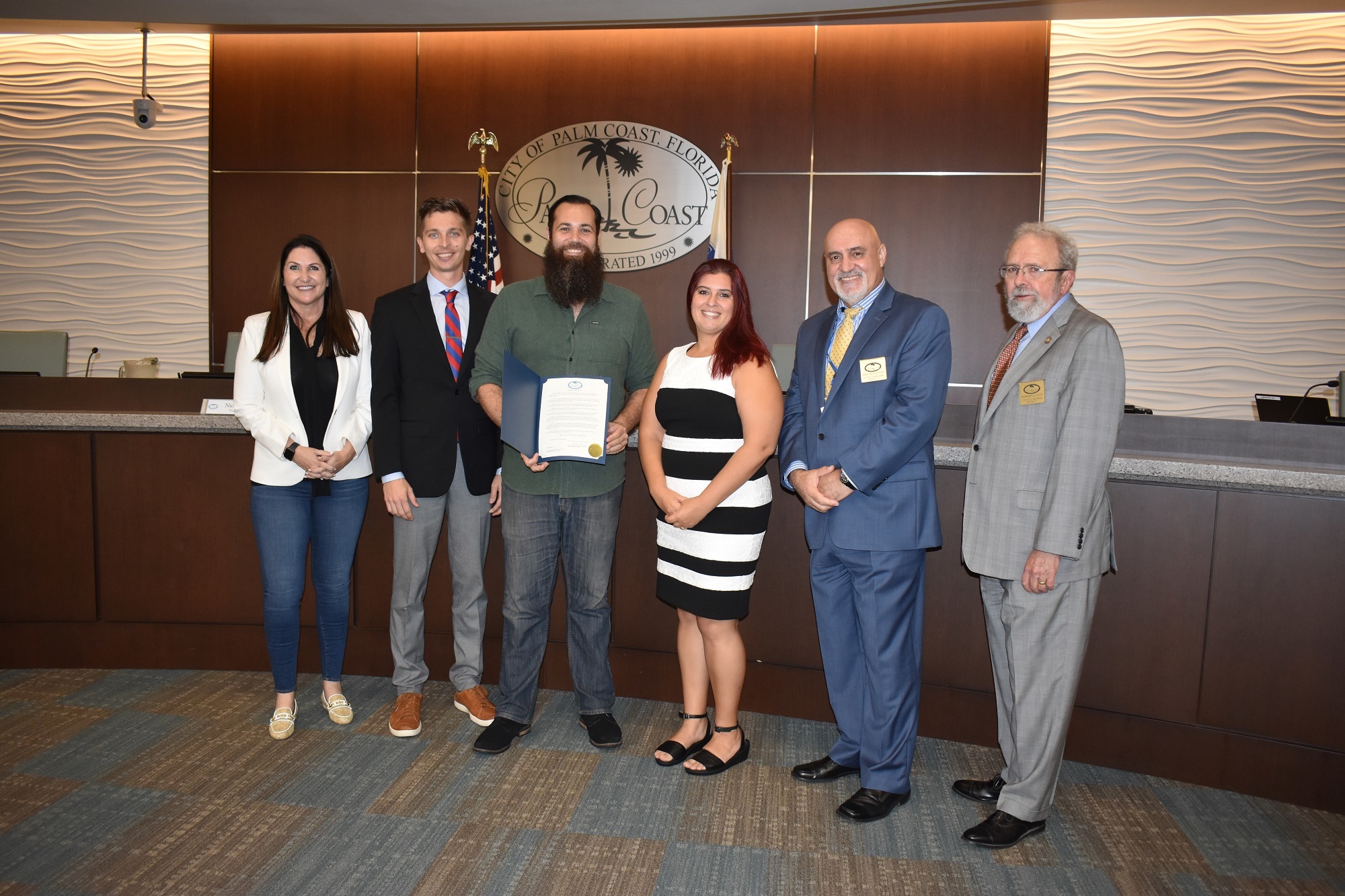 Palm Coast City Council members, a representative from Moonrise Brewing Company and a representative from MPower Fitness. Courtesy of the city of Palm Coast