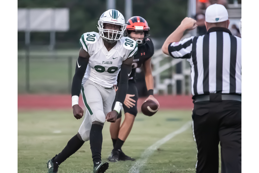 FPC's Malakai Grant celebrates after a sack against Spruce Creek in 2019. File photo