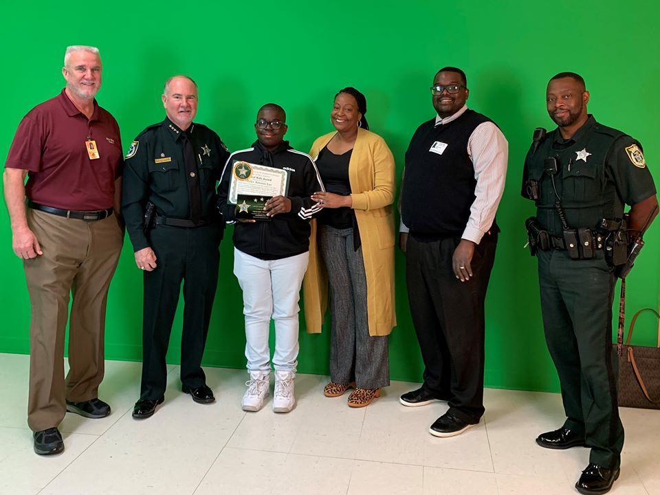 ITMS Principal Paul Peacock, Sheriff Staly, Myles, Mrs. and Mr. Lee, and SRD Cooper. Courtesy of FCSO