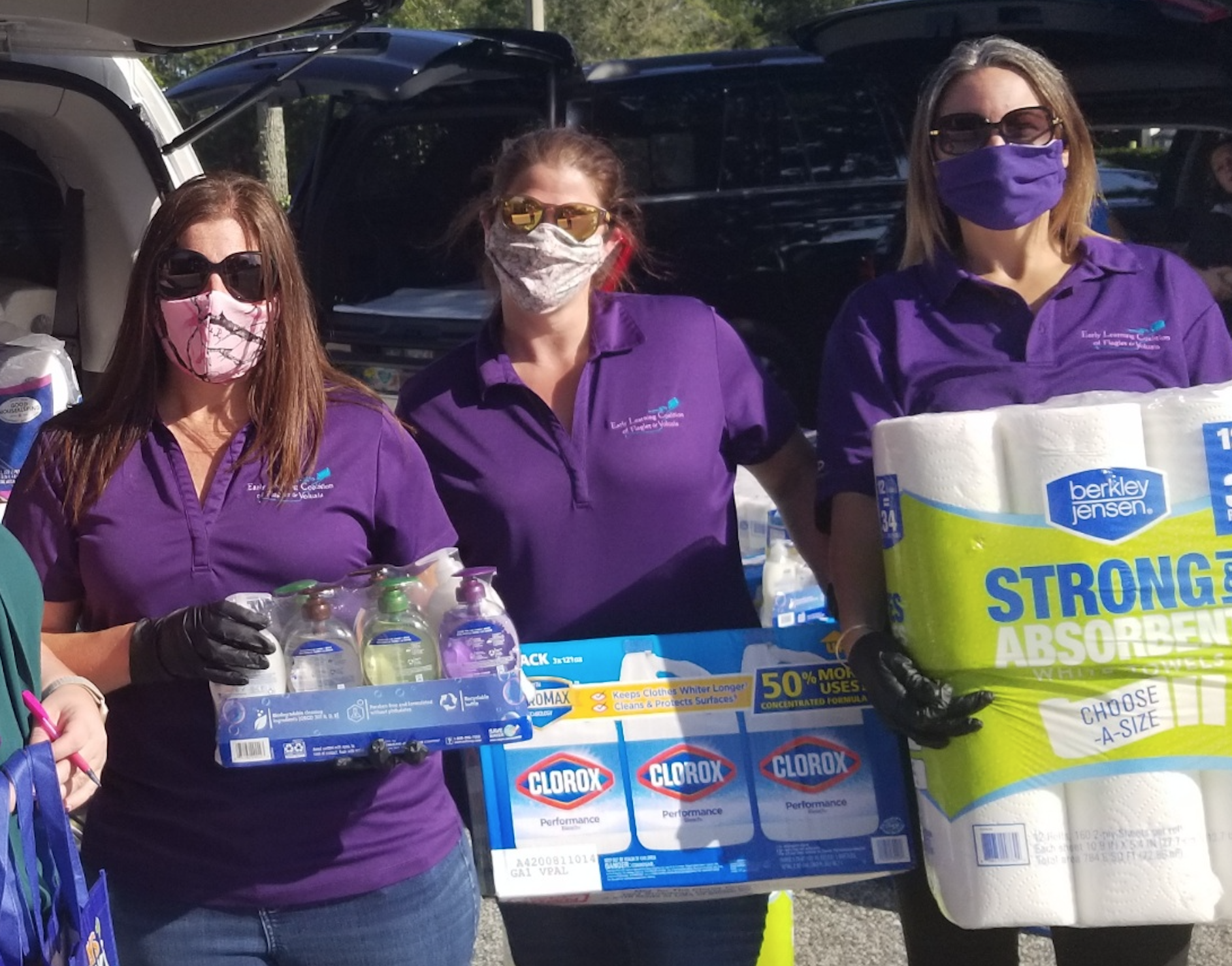 Delores Cope, Melanie Barclay and Kim Kania, of the Early Learning Coalition of Flagler and Volusia, help deliver some of the $22,000 in cleaning supplies for child care facilities, thanks to a United Way Grant. Courtesy photo