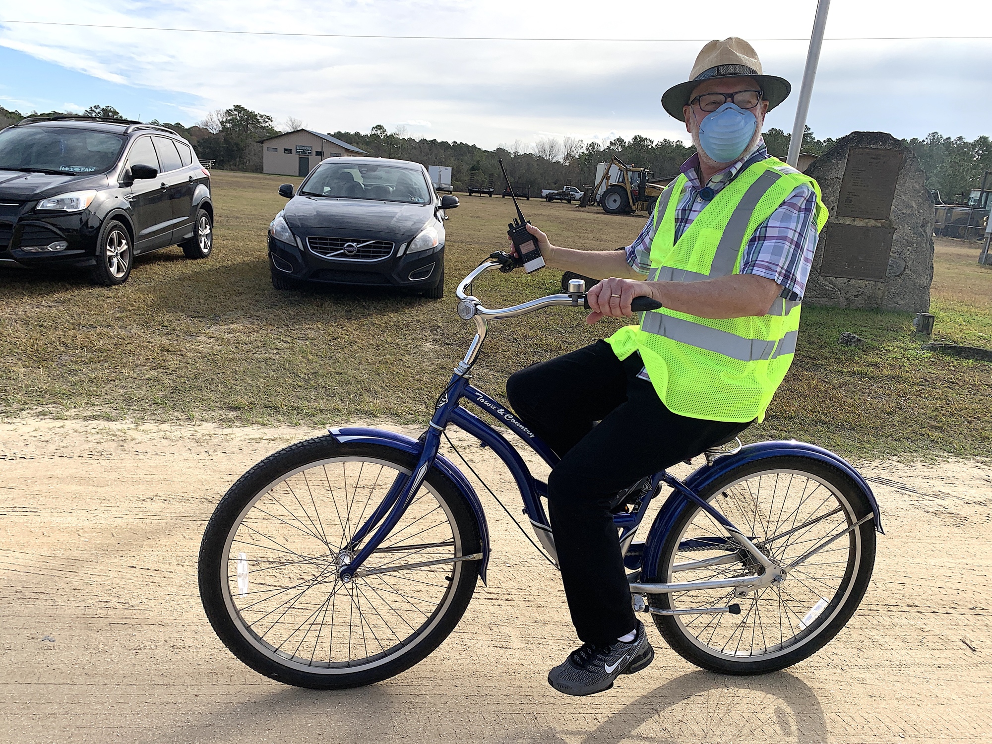 Bob Snyder, DOH health officer, rode his wife's bicycle around the fairgrounds to check on each station and boost morale.