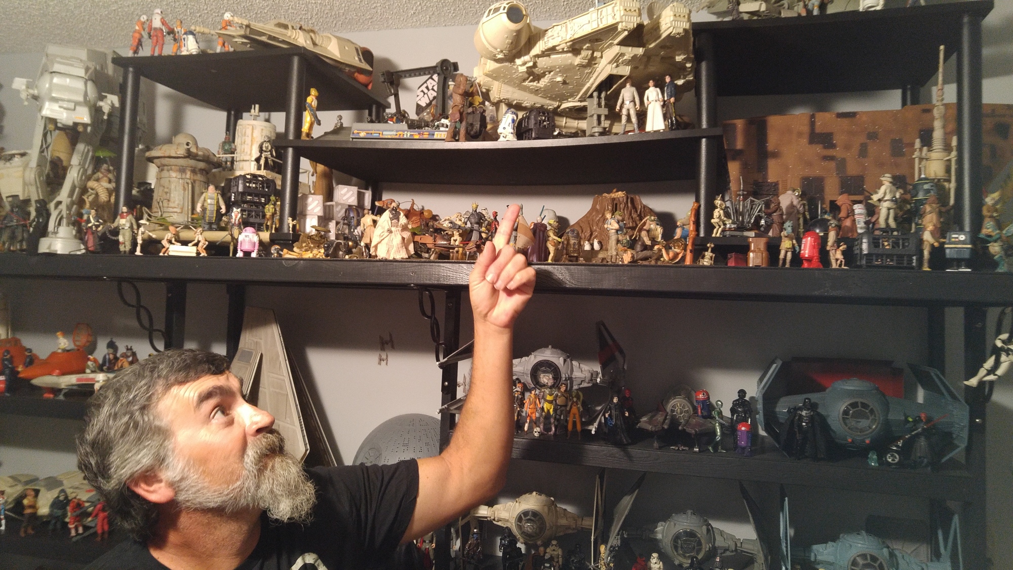DeDeo points to the Millennium Falcon model on a shelf in his Star Wars room. Photo by Brent Woronoff