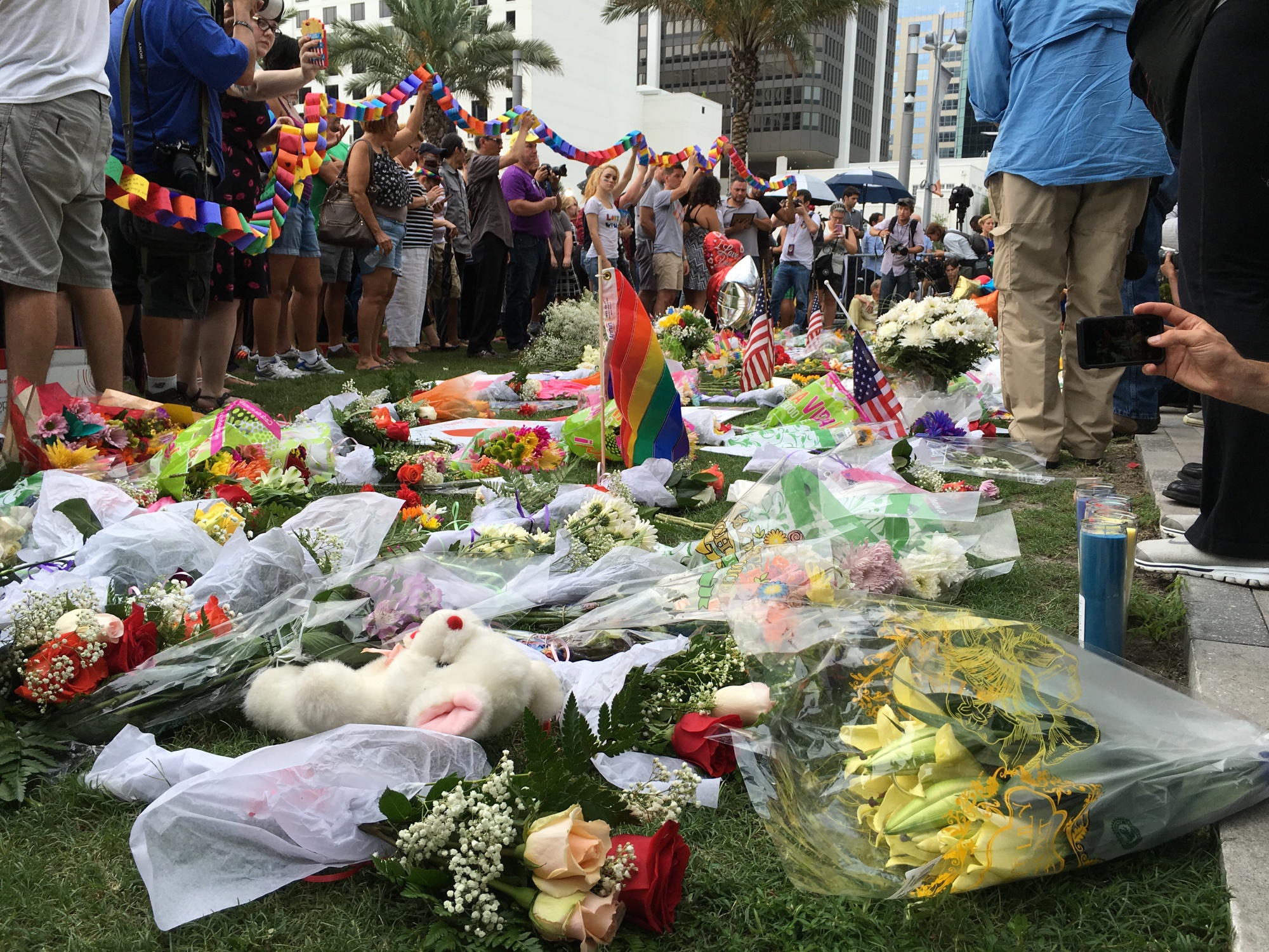 Mourners lay flowers in Orlando.