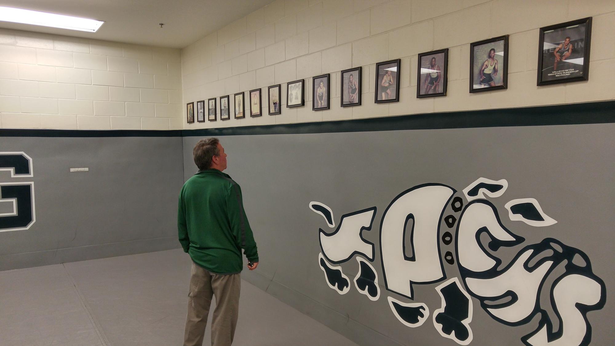 Steve DeAugustino strolls down memory lane in FPC's wrestling room. Photo by Brent Woronoff