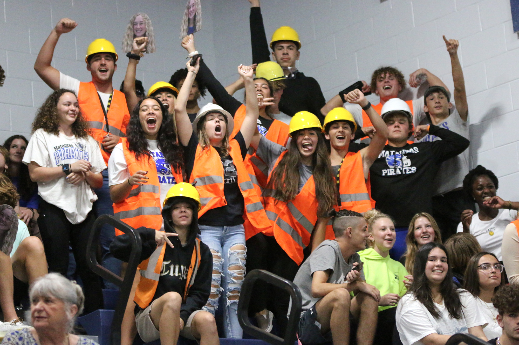 Tate Winecoff helps organize themed student sections at athletic events, such as this construction theme at a volleyball game against FPC. Photo by Brent Woronoff