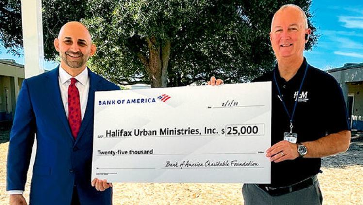 Peter Mannino, president of Bank of America East Central Florida; and Buck James, executive director of Halifax Urban Ministries, Inc. Courtesy photo