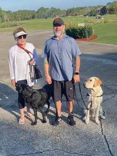 Margo Whalen, her veterans assistance dog Scotty, and retired U.S. Marine Capt. Mike Deardorff and Ryan. Courtesy photo