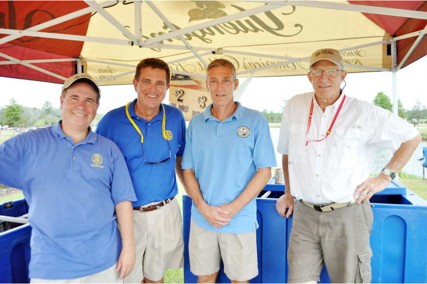 John Moden, far right, poses for a photo in 2011, with other community leaders, Jim Manfre, Kent Ryan and Jay Gardner.