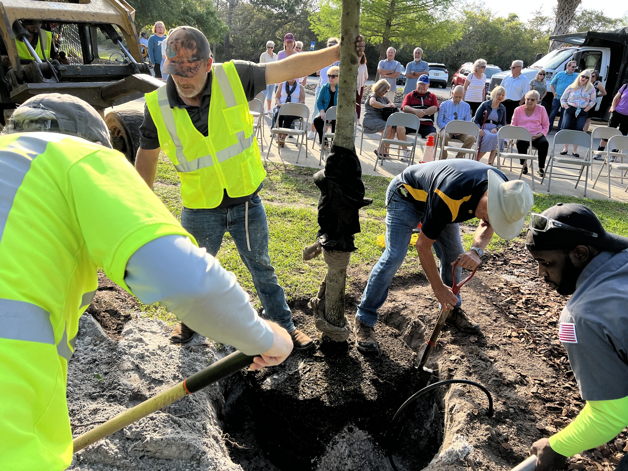 “There’s nothing more appropriate than planting a tree, because you’re thinking about how someone’s life impacts the future,” Rotarian Mike Kuypers said at the memorial. Photo by Brian McMillan