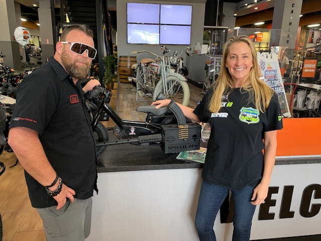 Jim Lynch, of Revelation 1 Cycle Solutions, and Daytona Harley-Davidson Event and Promotions Manager Mandy Rossmeyer with the bike Lynch designed. Courtesy photo