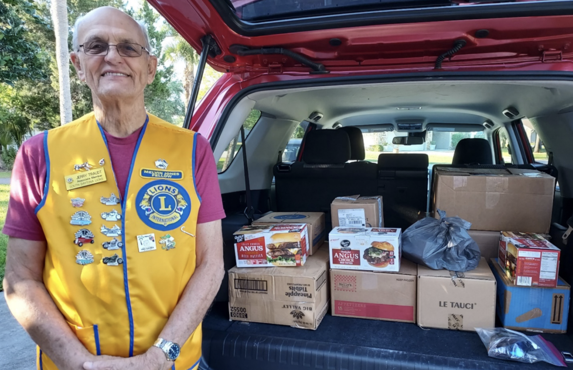 South Daytona Lions Club member Jerry Traudt with the boxes containing 704 pairs of eyeglasses collected during April by the Lions Clubs in East Volusia County. Courtesy photo