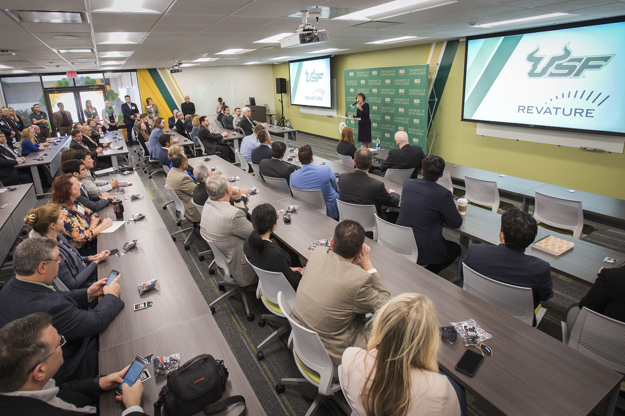 USF President Judy Genshaft, at podium, announcing the university's expanded partnership with tech talent development firm Revature. Courtesy photo.