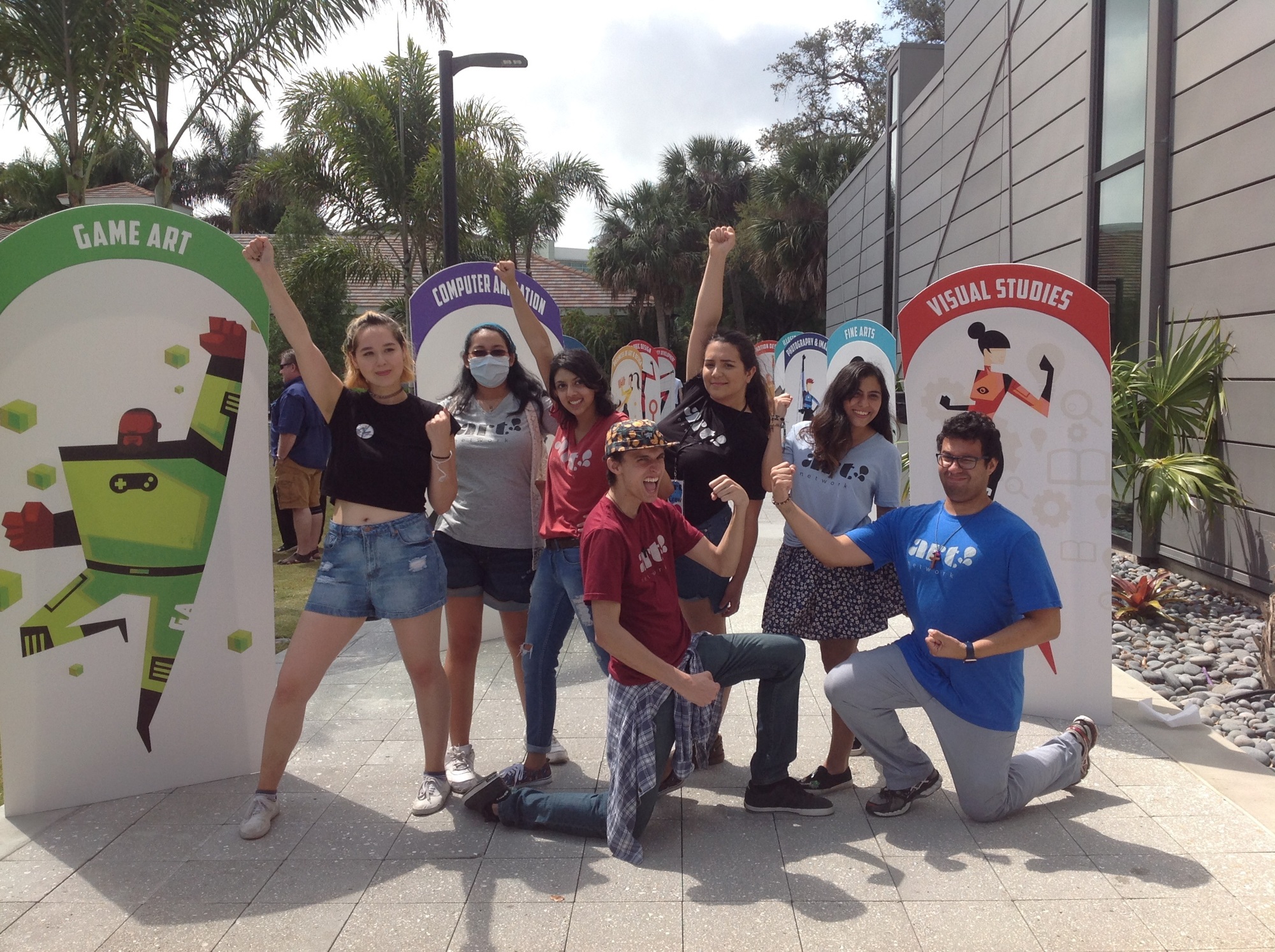 Students at Ringling College of Art and Design's accepted student day held April 7, 2018, posed with cardboard cutouts of superhero characters representing the college's majors.
