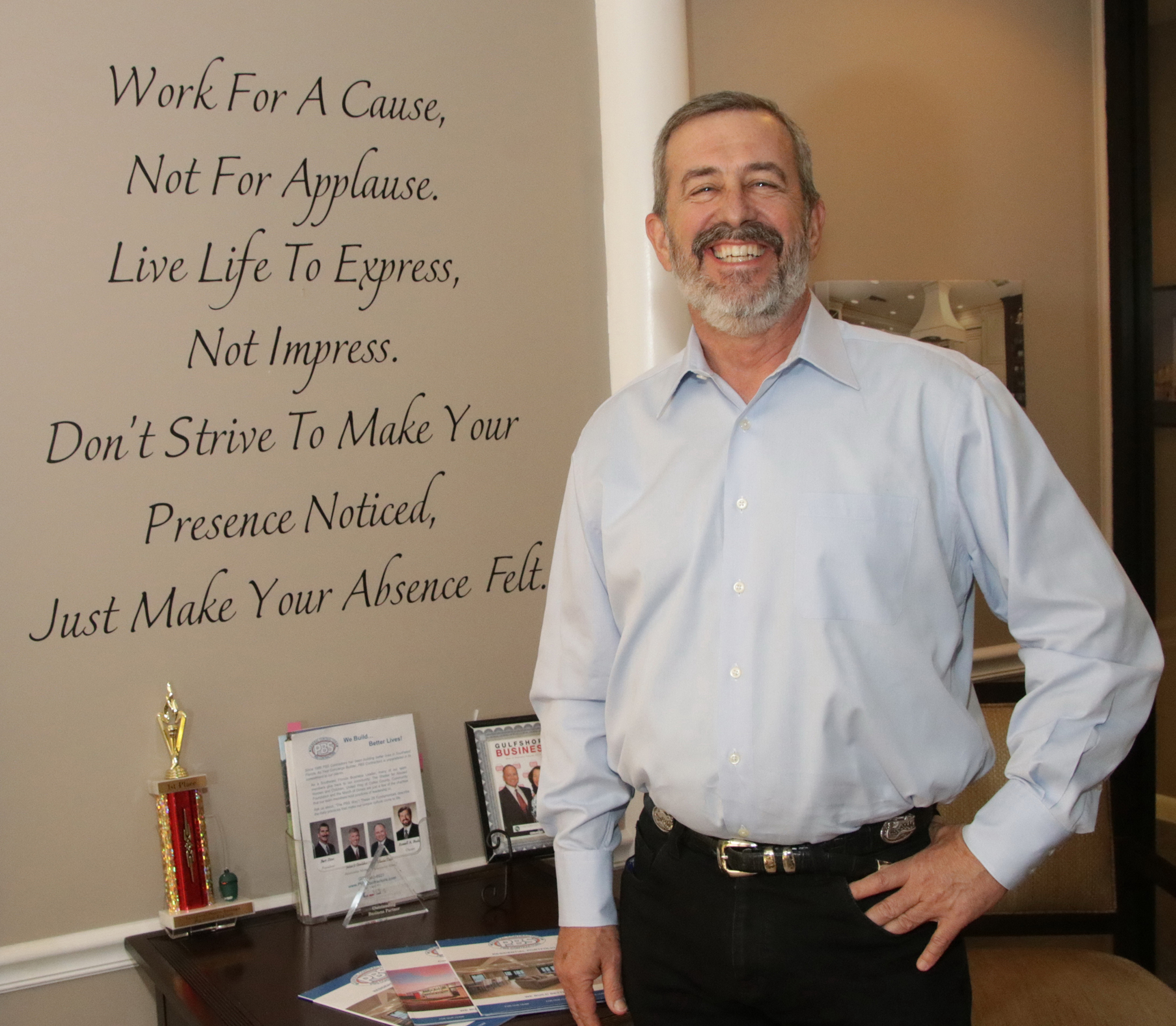 Jim Jett photo. An inscription that describes PBS Contractors business and personal philosophy serves as a reminder for employees as they enter the lobby of their Naples office.