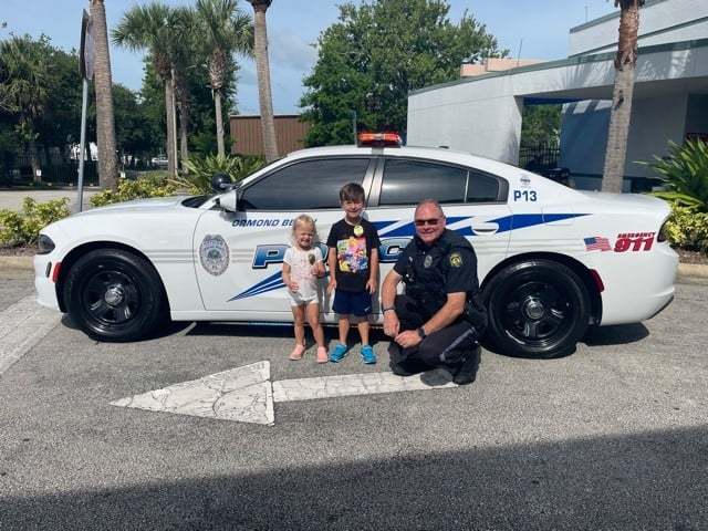 Nathan and Grace Gable with Ormond Beach Police Officer Robert Pearson. Courtesy photo