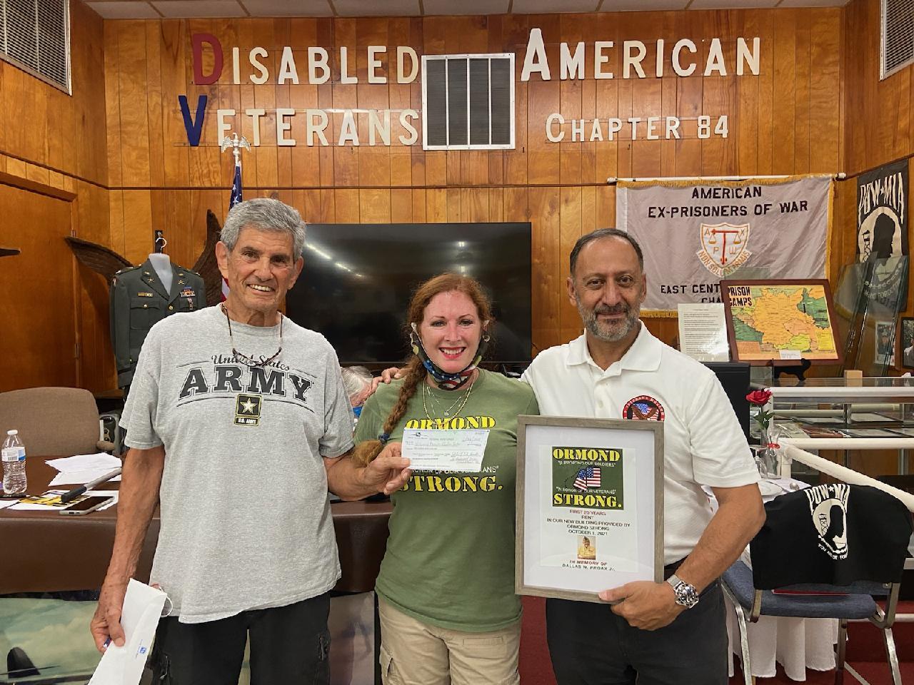 Ormond Strong member Marvin Miller, Ormond Strong Commander Debbie Kruck-Forrester and Commander Jose Rosa accept the donation on behalf of the museum. Courtesy photo