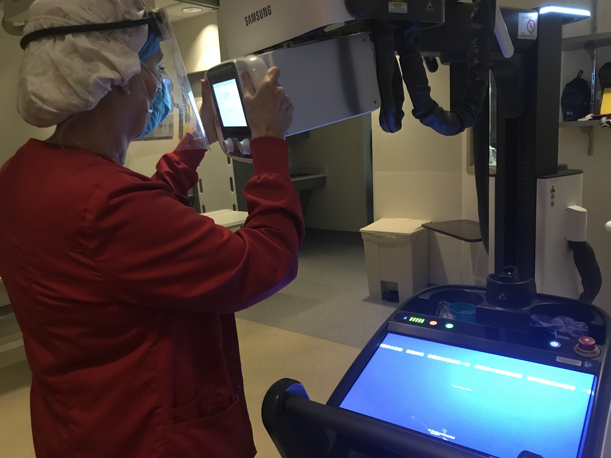 Merrilee Felkel using a portable X-ray machine in diagnostic radiology. Photo courtesy of Merrilee Felkel