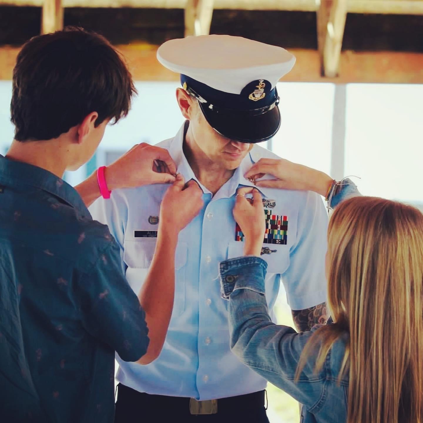 Justin Alley's badge is pinned by his children, Jackson and Jaycee. Courtesy photo