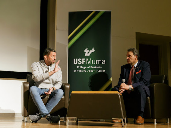 Courtesy. Adidas CEO Kasper Rorsted, left, chats with USF Muma College of Business Dean Moez Limayem during Rorsted's visit to the university's Tampa campus on March 31.