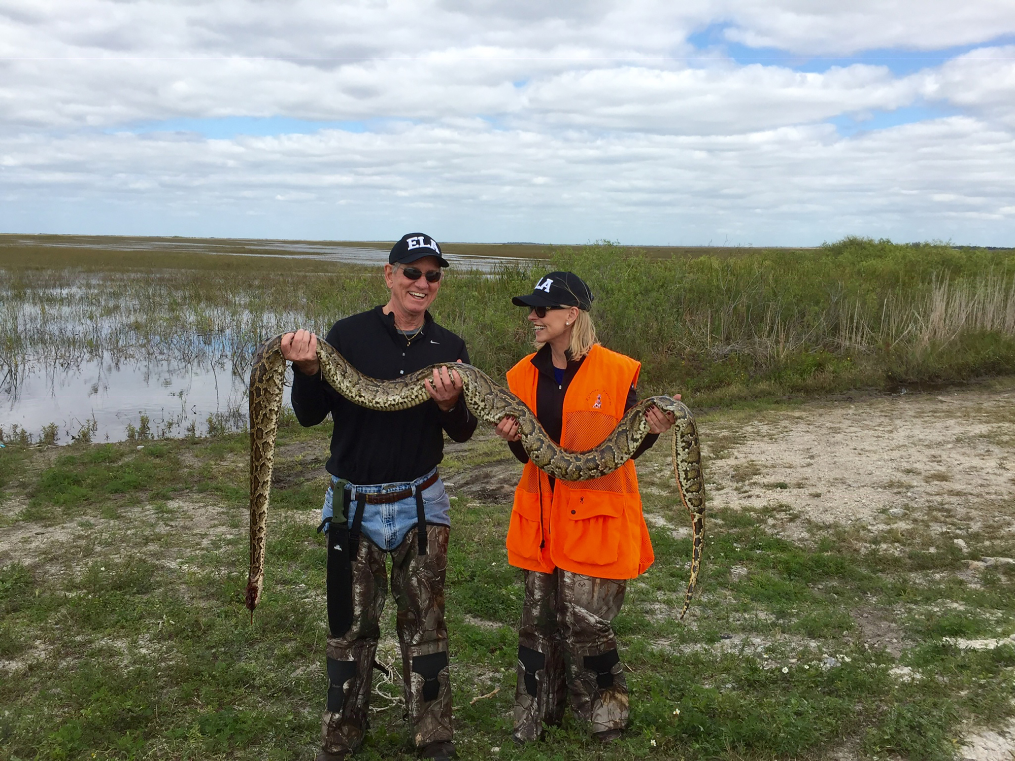Edison National Bank co-founders Geoff and Robbie Roepstorff enjoy hunting pythons together. The even spent their 25th anniversary in the Everglades. Courtesy Geoff and Robbie  Roepstorff