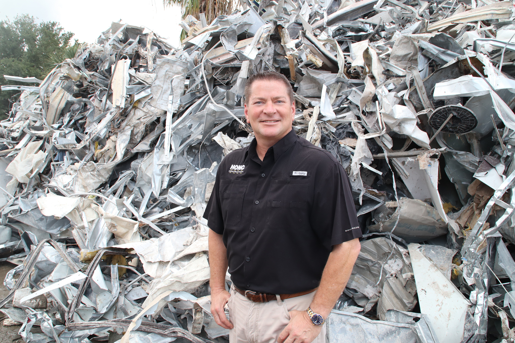Honc Recycling owner David Mulicka with a pile of treasure, metals being recycled from demolition and construction debris. JimJett.com photo