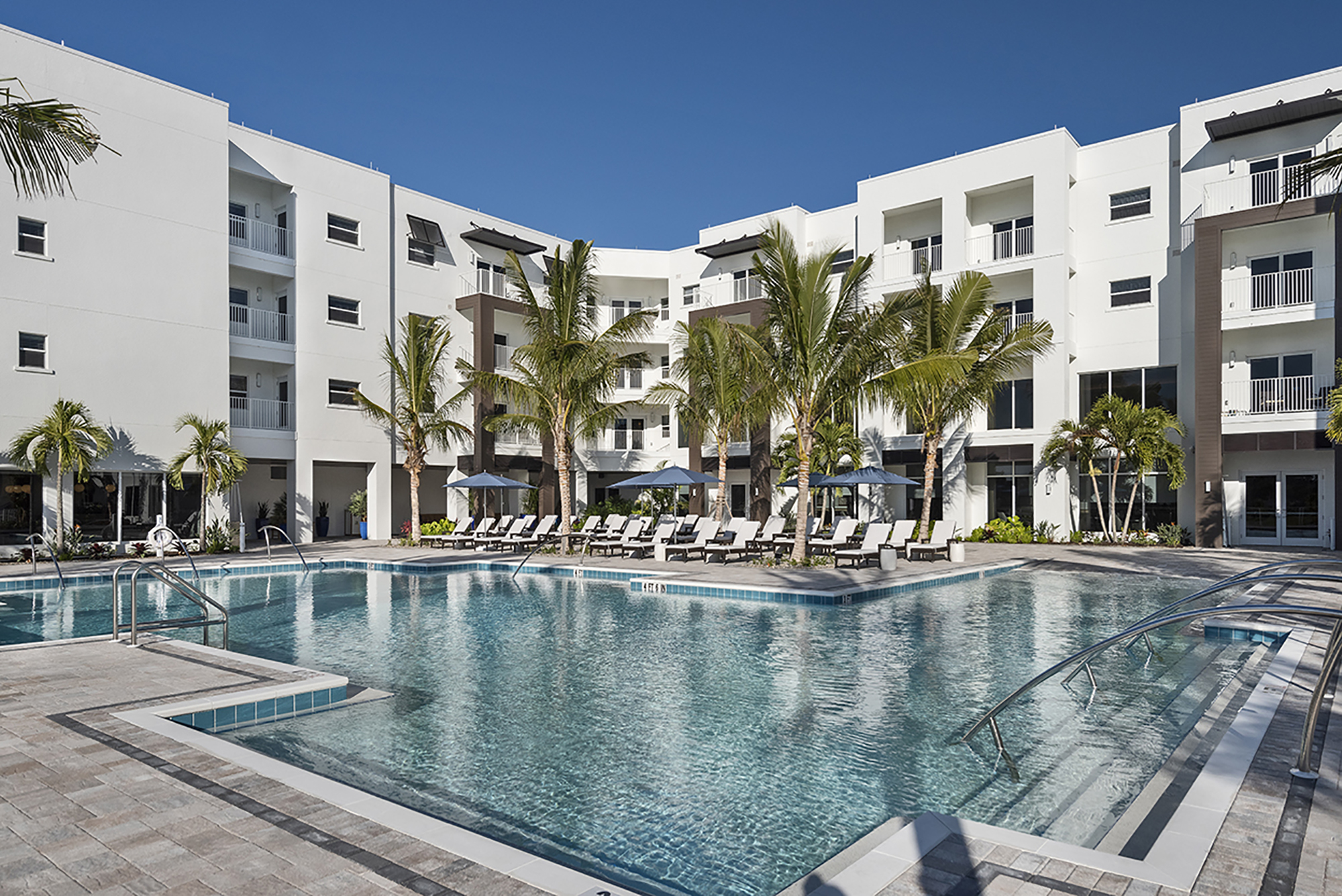 Amavida features resort-style amenities that complement the mid-century architecture of the 460-unit senior living community. This pool is one of two. Courtesy Amavida