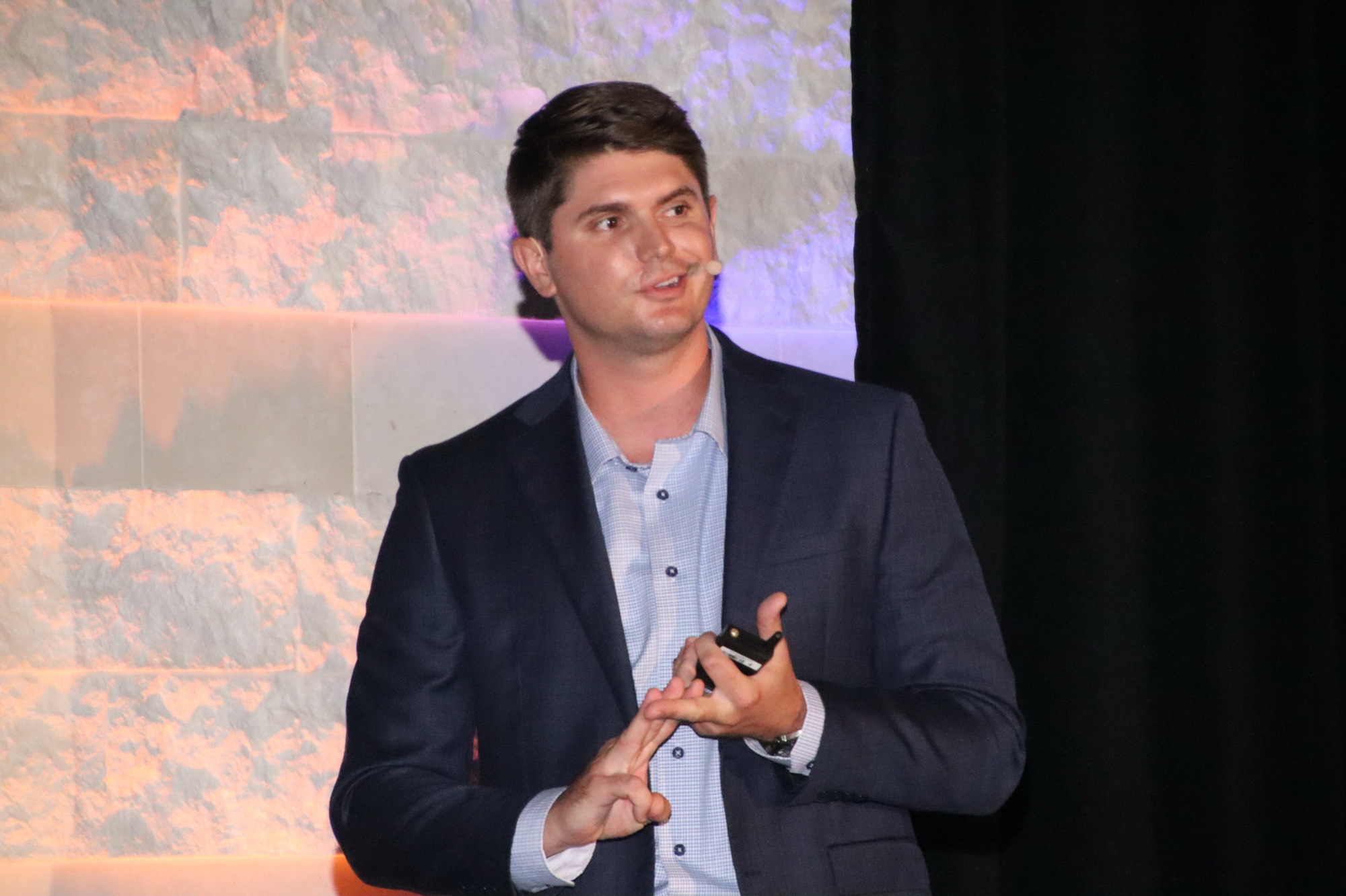 JIM JETT — LSI Cos.' COO Justin Thibaut addresses a crowd of roughly 400 who attended the company's annual Market Trends presentation on Aug. 13 at the Miromar Design Center, in Fort Myers.