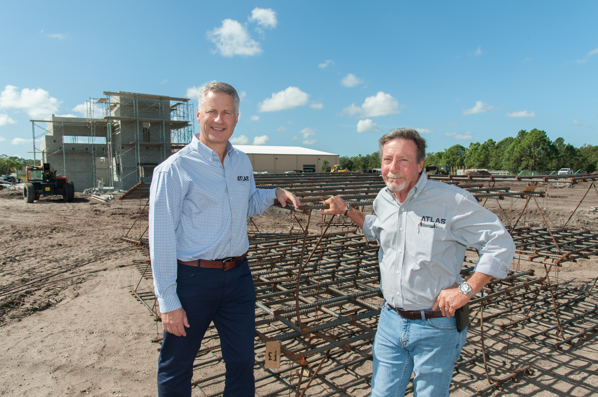 Lori Sax. Sarasota-based Atlas Building Co. President Andy Stultz and Vice President of Construction Charlie Woehle are working on a Wheel Base Premium Garage Condos project in Sarasota.