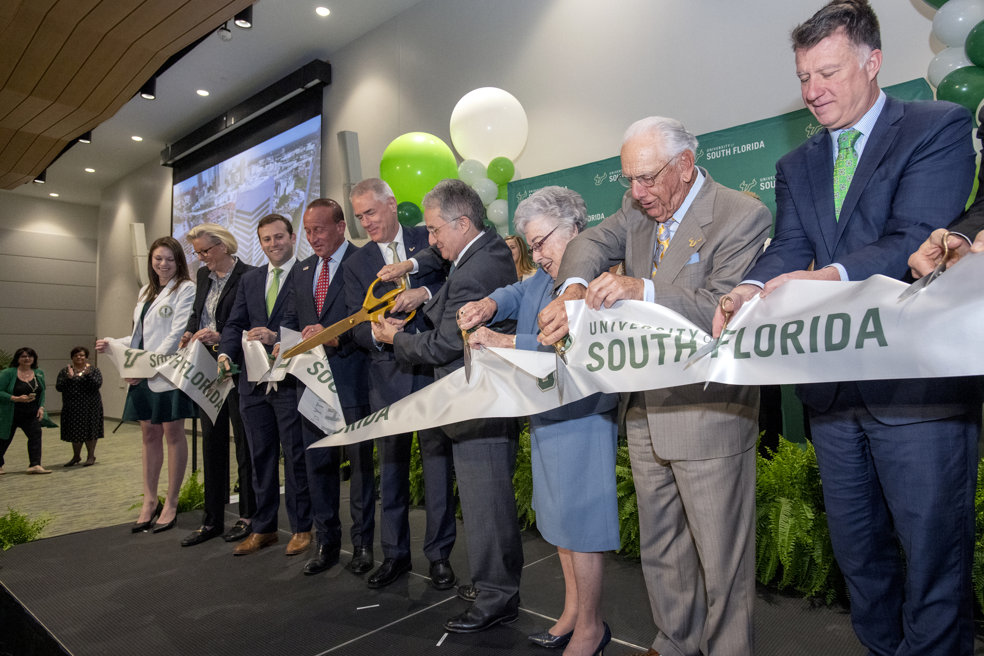Tampa Mayor Jane Castor, second from left, helps cut the ribbon on USF Health's new Morsani College of Medicine and Heart Institute. Holding the scissors are USF President Steven Currall and USF Health leader Dr. Charles Lockwood. Courtesy photo.