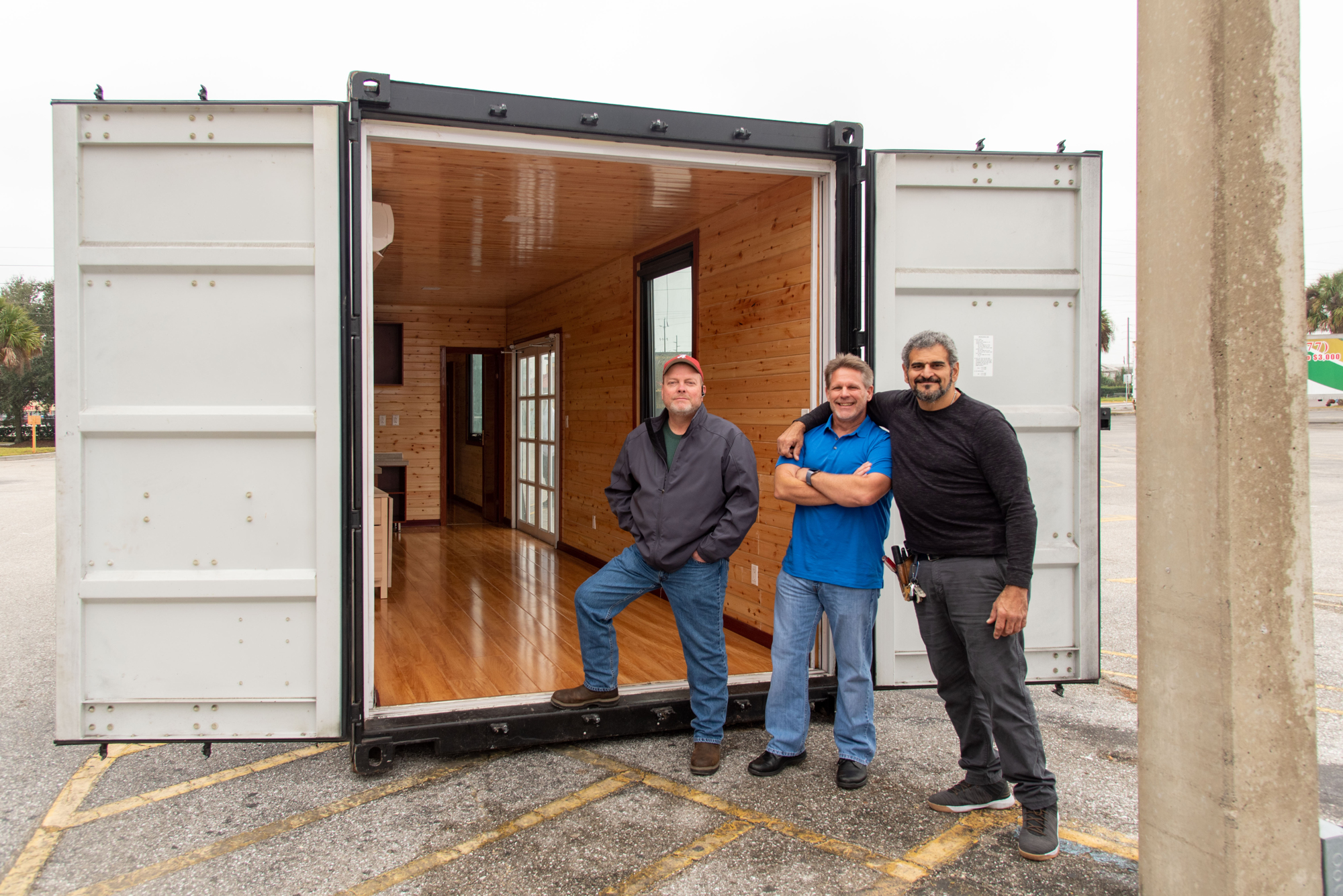 Lori Sax. Danny Nelms, Joe Davis and Mario Cimmino are with Innovar Homes, which is building shipping container homes out of a factory in Hardee County.