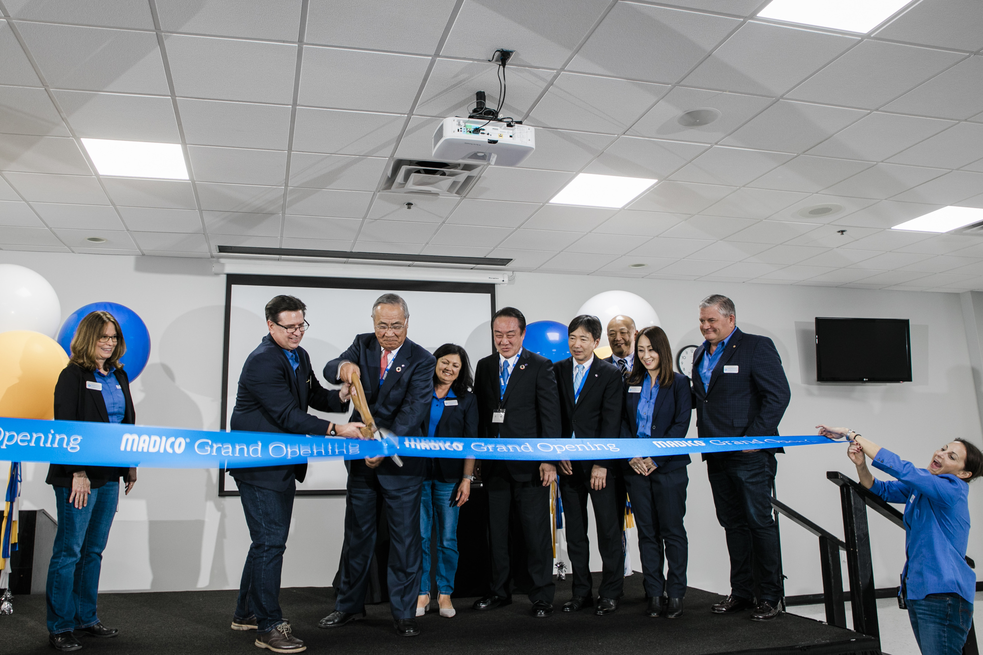 Madico executives cut the ribbon on the firm's new headquarters and manufacturing facility in Pinellas Park. Courtesy photo.