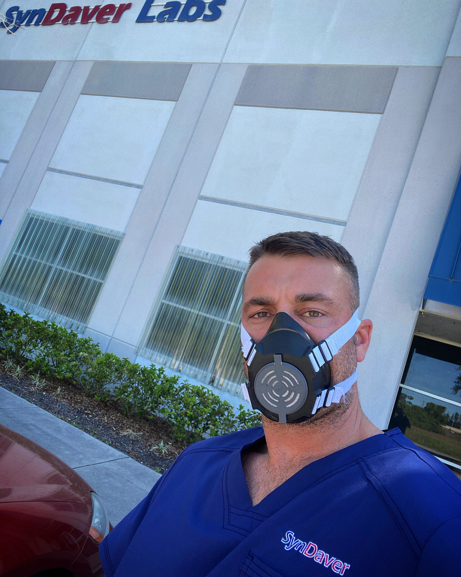 A SynDaver employee wears one of the respirator masks that the Tampa biotech firm has begun to produce. Courtesy photo.