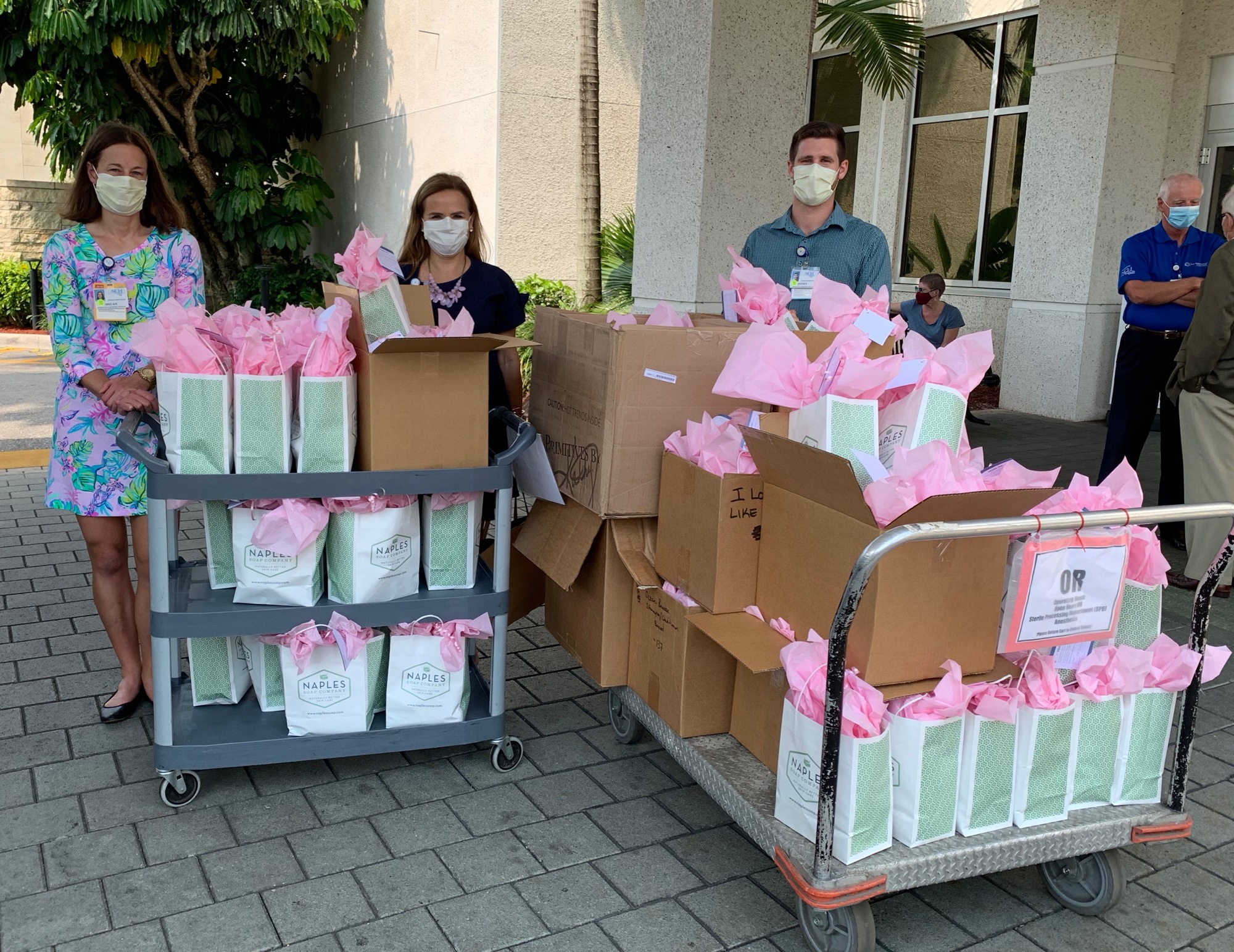 Courtesy. Megan Riley, Paula DiGrigoli, and Jeffrey Zieminski load over 100 comfort care kits to be delivered to night shift nurses and doctors at NCH’s Baker Hospital in Naples.  