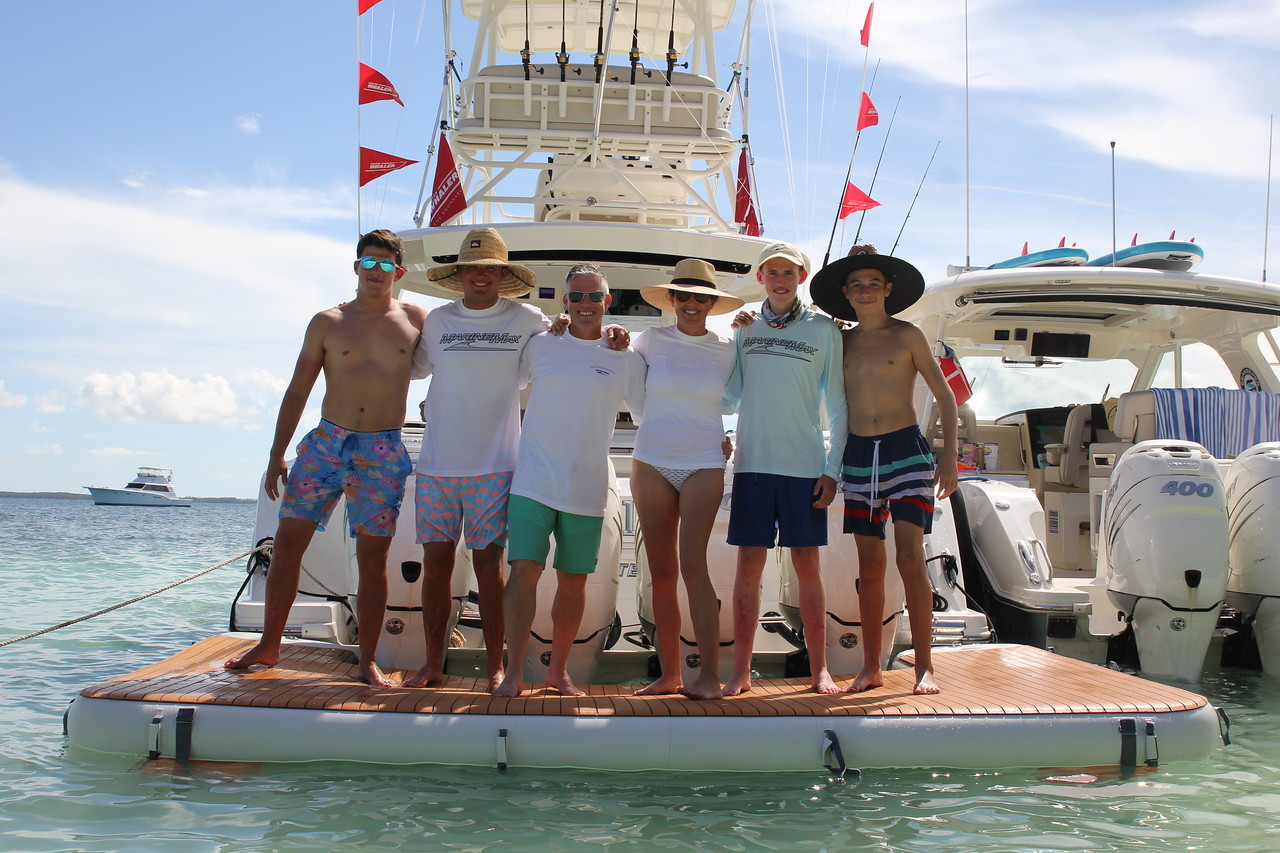 Courtesy. MarineMax CEO Brett McGill, third from left, with his family aboard their Boston Whaler boat.