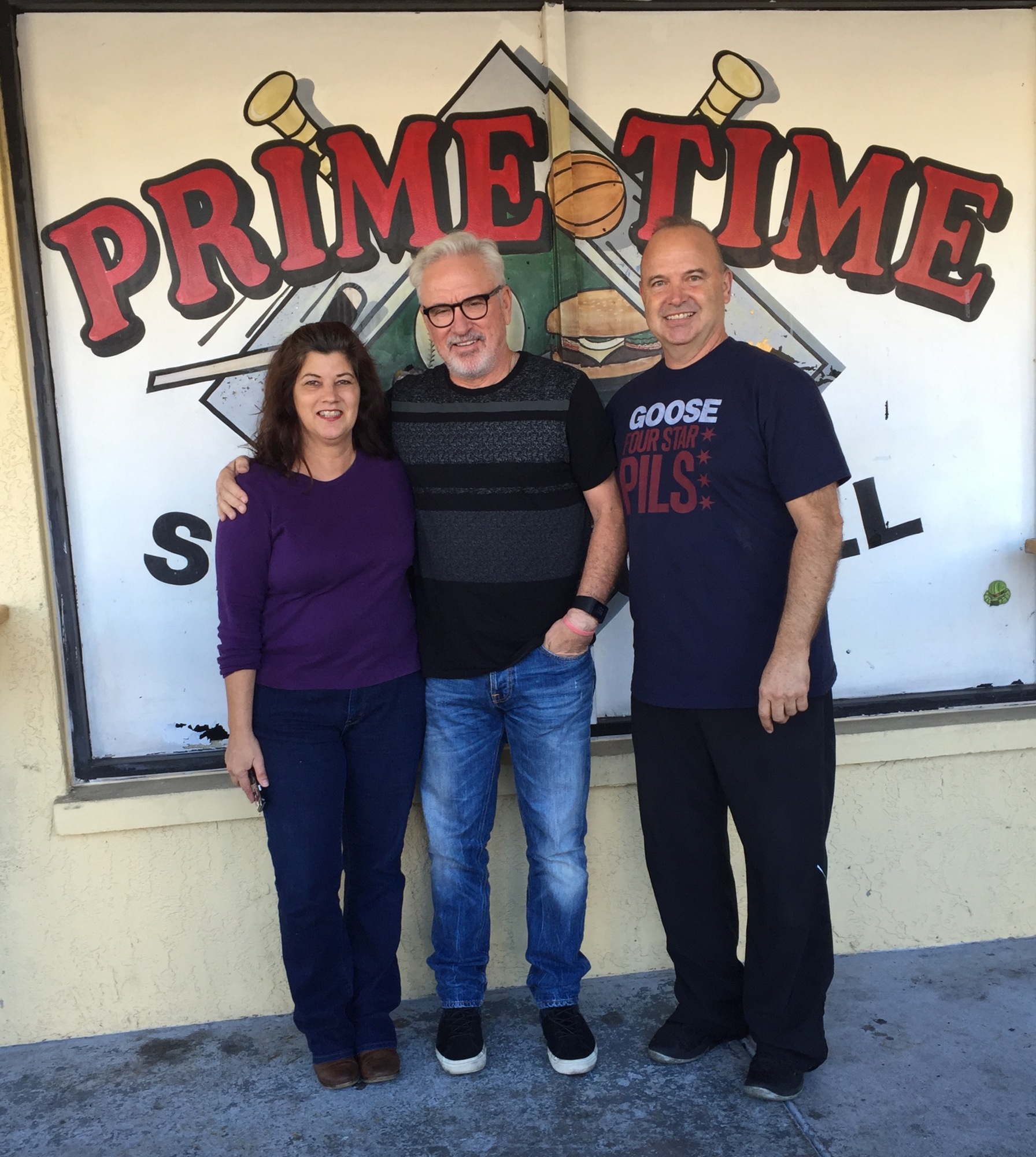Prime Time Sports Grill owners Doug and Denise Craine, with former Tampa Rays manager Joe Maddon.