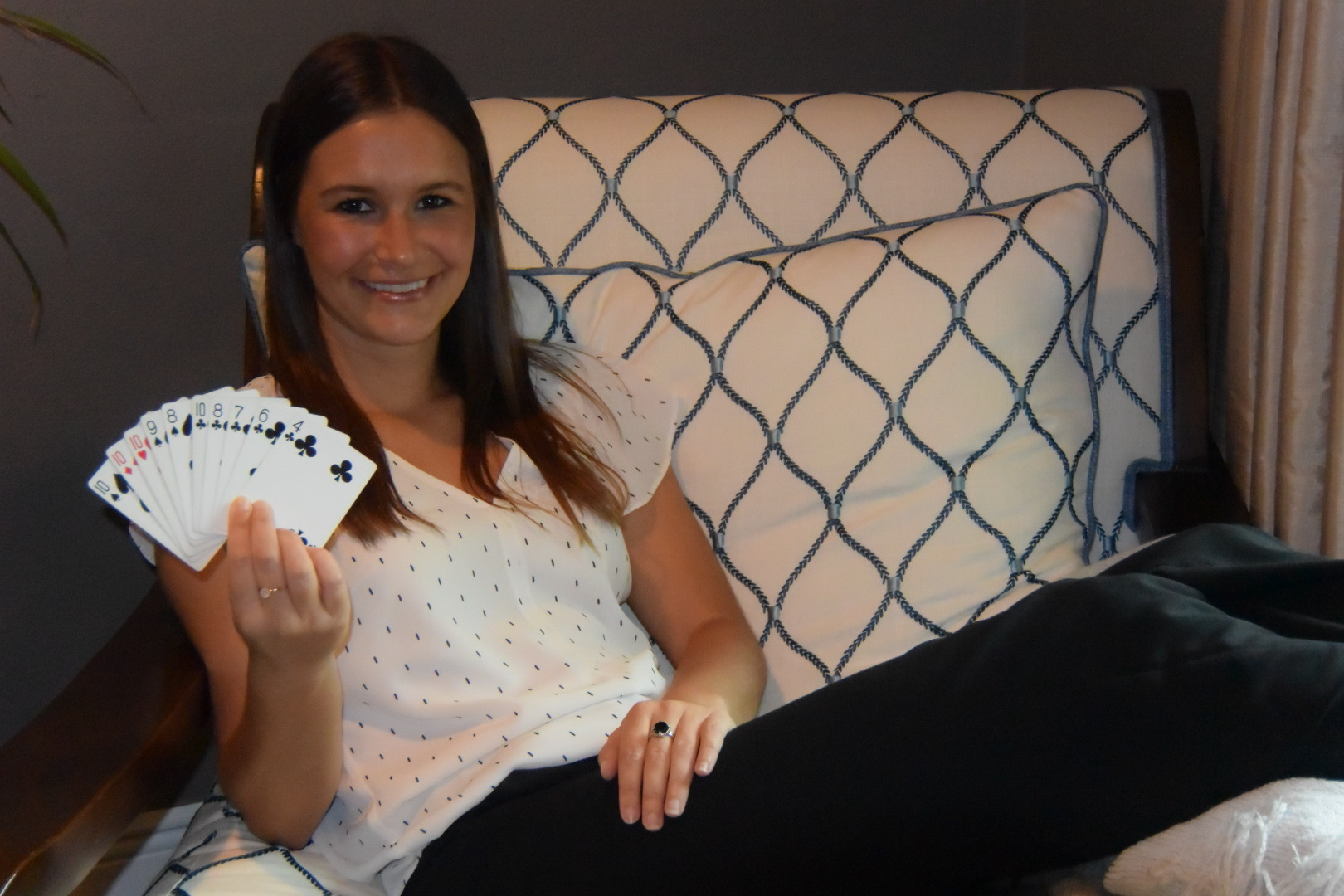 COURTESY PHOTO — Erin VanderVeen, with Stratum Health/Tidewell Hospice, relaxes at home while showing off her card-handling skills.