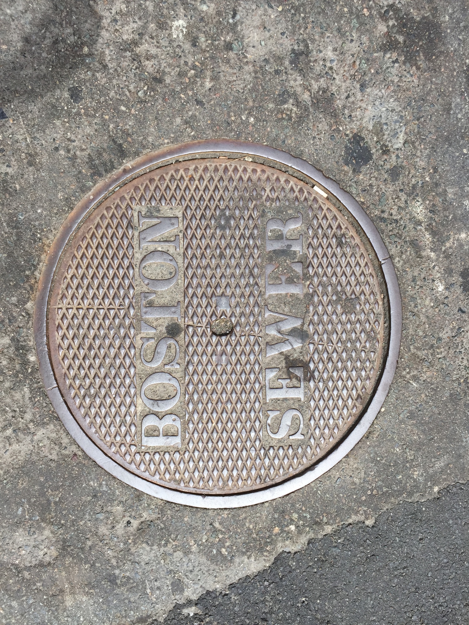 Courtesy. David Farmer has taken pictures of manhole covers across the world, such as this one in Boston.
