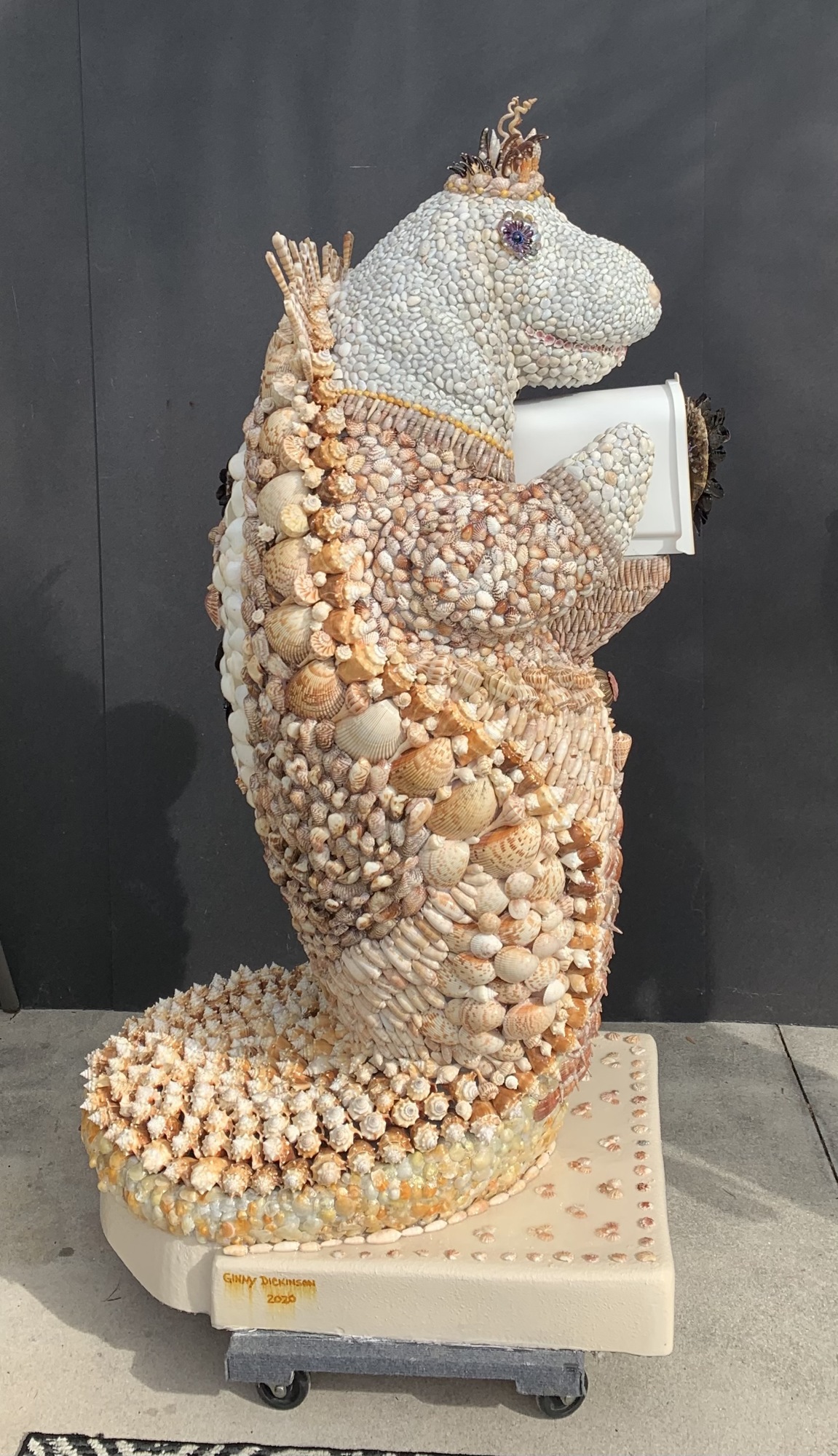 Courtesy. Ginny Dickinson recently created Her Royal Majesty – Manatee Mer, a seashell sculpture. This is her third sculpture, and like the other two, will be auctioned for charity.