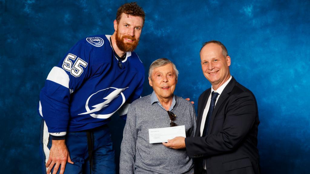 the Tampa Bay Lightning named Dwayne Hawkins, center, a community hero before a game Jan. 13, 2020.