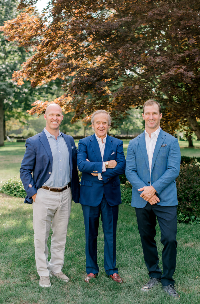 Courtesy. Pictured, from left, are WRRE Co-President Chris Raveis, CEO/Founder Bill Raveis, and Co-President Ryan Raveis.