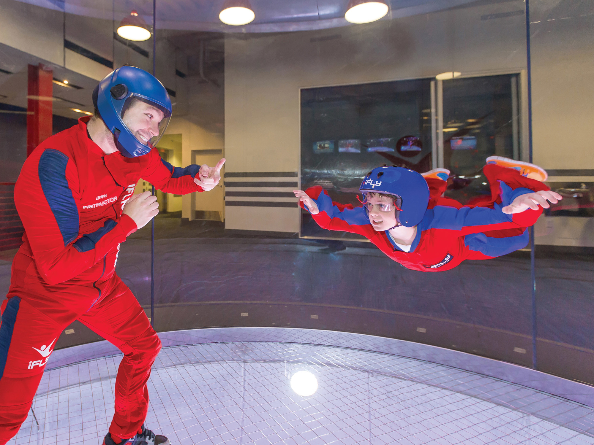 At iFLY, giant fans that can generate 175 mph winds simulate the experience of skydiving.