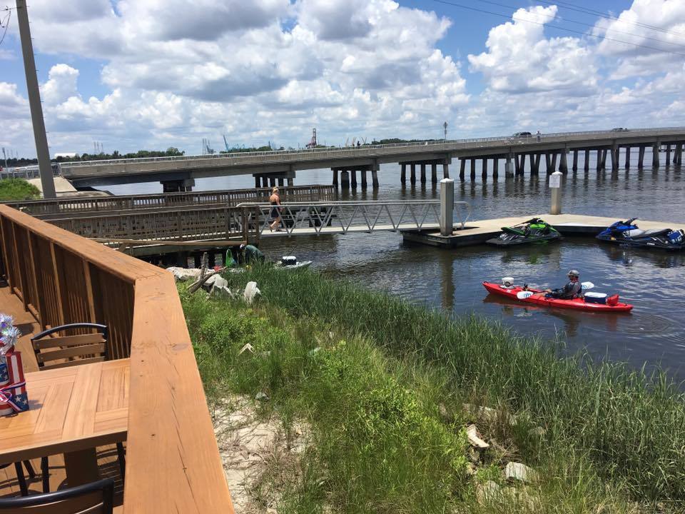 The deck at the Palms Fish Camp Restaurant overlooks the boat dock and kayak launch on Clapboard Creek near the St. Johns River.