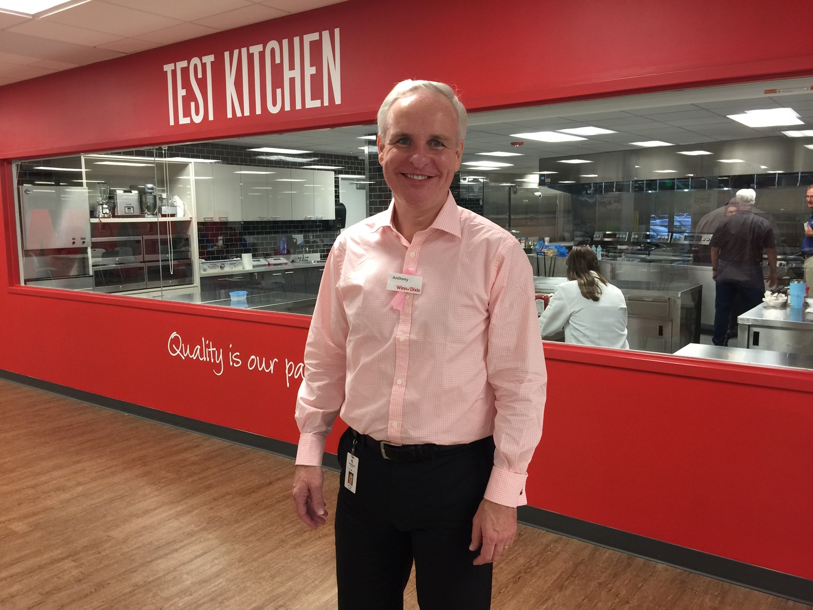 Southeastern Grocers CEO Anthony Hucker stands in front of the test kitchen at the company’s headquarters. The company has been working to improve the quality and value of its private-label brands.